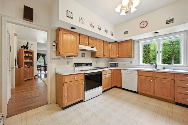 15 Loon Call Dr, Belgrade, ME 04917 - kitchen with white appliances, under cabinet range hood, light countertops, light flooring, and a towering ceiling
