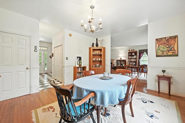 15 Loon Call Dr, Belgrade, ME 04917 - dining area with light wood-type flooring and a chandelier