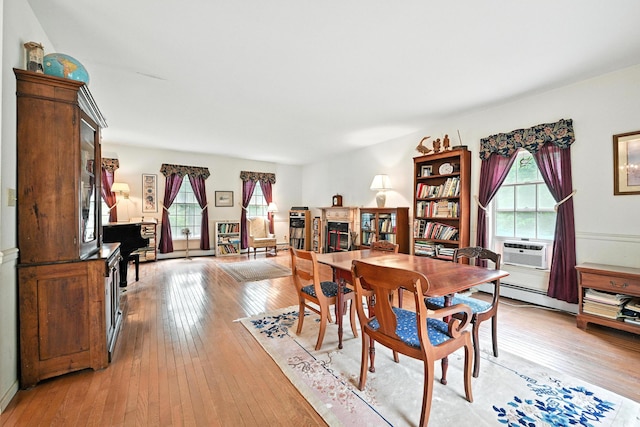 15 Loon Call Dr, Belgrade, ME 04917 - dining area featuring light wood-type flooring, a baseboard radiator, and cooling unit