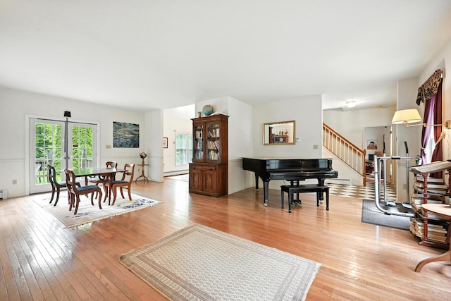 15 Loon Call Dr, Belgrade, ME 04917 - living room featuring stairway, light wood-type flooring, and baseboard heating