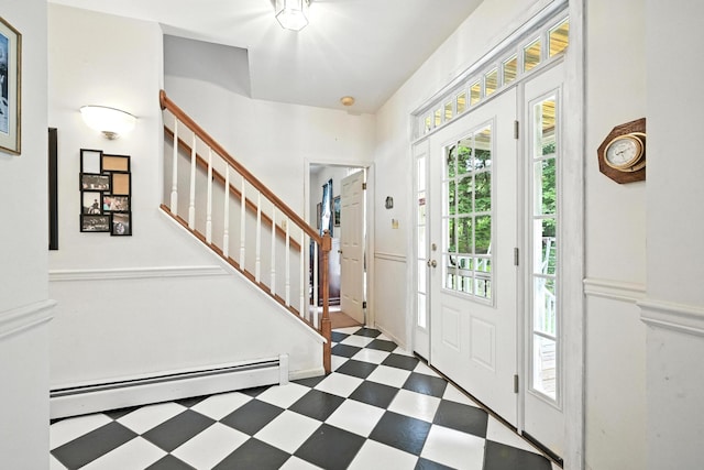 15 Loon Call Dr, Belgrade, ME 04917 - foyer featuring baseboard heating, tile patterned floors, plenty of natural light, and stairs