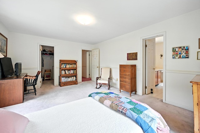 15 Loon Call Dr, Belgrade, ME 04917 - bedroom with light colored carpet, a spacious closet, and ensuite bathroom