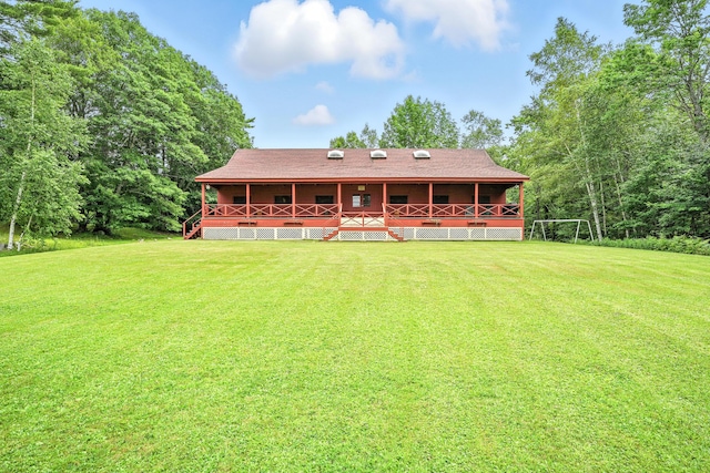 15 Loon Call Dr, Belgrade, ME 04917 - back of house with a yard and covered porch