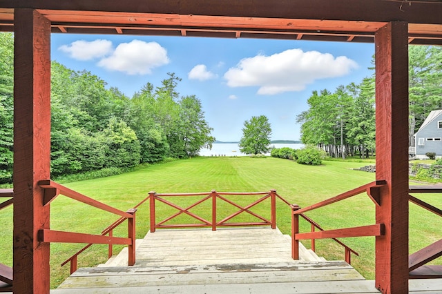 15 Loon Call Dr, Belgrade, ME 04917 - view of grassy yard with a deck with water view