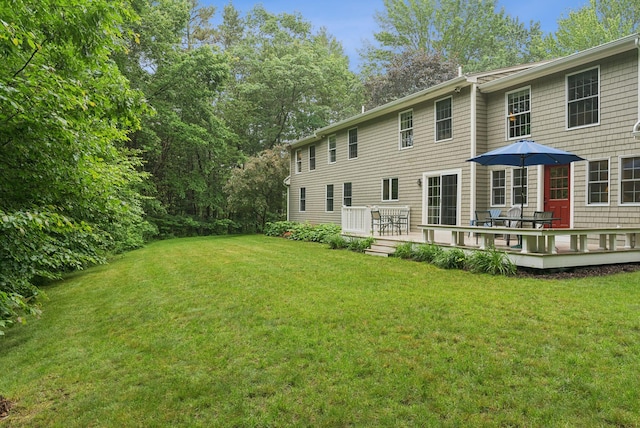 3 Flintlock Ln, Falmouth, ME 04105 - back of property featuring a lawn and a wooden deck