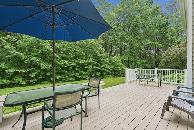 3 Flintlock Ln, Falmouth, ME 04105 - deck with outdoor dining space, a yard, and view of scattered trees