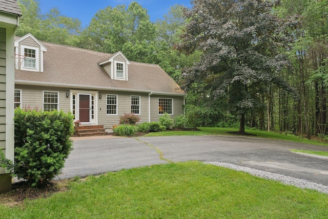 3 Flintlock Ln, Falmouth, ME 04105 - view of front of house with a shingled roof and a front yard
