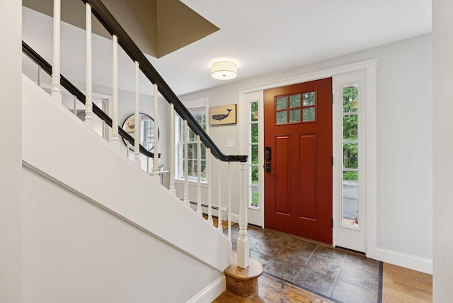 3 Flintlock Ln, Falmouth, ME 04105 - foyer featuring stairs, a baseboard heating unit, and stone finish floors