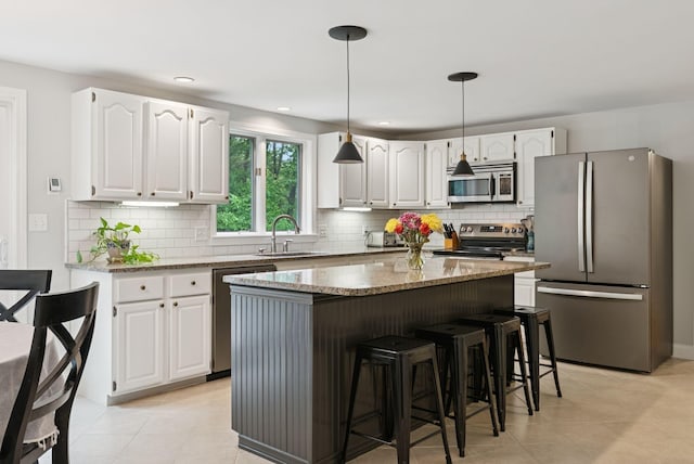 3 Flintlock Ln, Falmouth, ME 04105 - kitchen with appliances with stainless steel finishes, white cabinets, light stone countertops, and recessed lighting