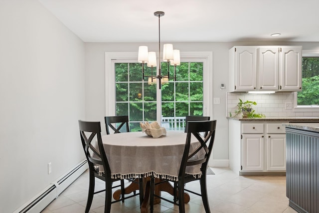 3 Flintlock Ln, Falmouth, ME 04105 - dining area featuring baseboard heating, a chandelier, and light tile patterned flooring