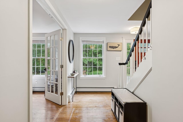 3 Flintlock Ln, Falmouth, ME 04105 - foyer with a baseboard radiator, stairs, and wood finished floors