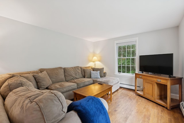 3 Flintlock Ln, Falmouth, ME 04105 - living area with a baseboard heating unit and light wood finished floors