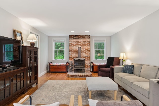3 Flintlock Ln, Falmouth, ME 04105 - living area with a wood stove, wood finished floors, and recessed lighting