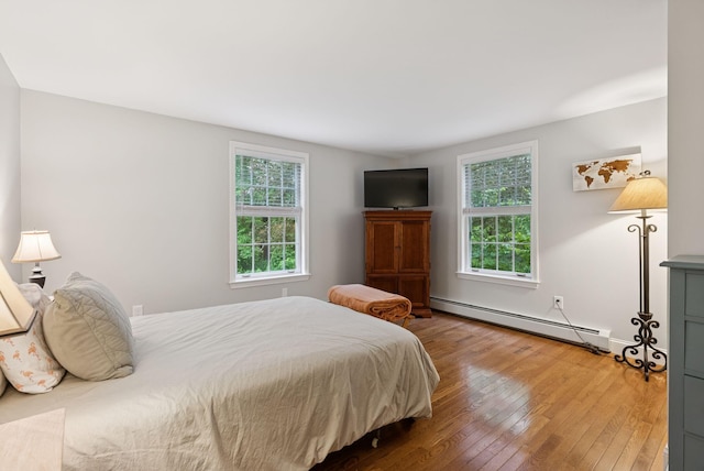 3 Flintlock Ln, Falmouth, ME 04105 - bedroom featuring a baseboard radiator and hardwood / wood-style floors