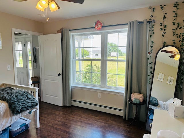 905 Blackstream Rd, Hermon, ME 04401 - bedroom with a baseboard radiator, multiple windows, and dark wood finished floors