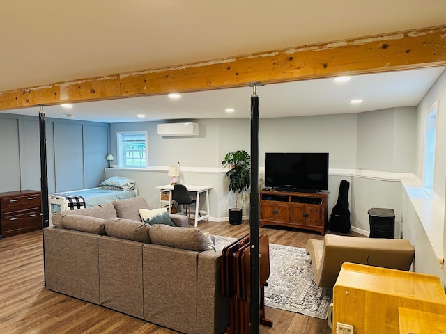 905 Blackstream Rd, Hermon, ME 04401 - living room featuring an AC wall unit, wood finished floors, recessed lighting, and beamed ceiling