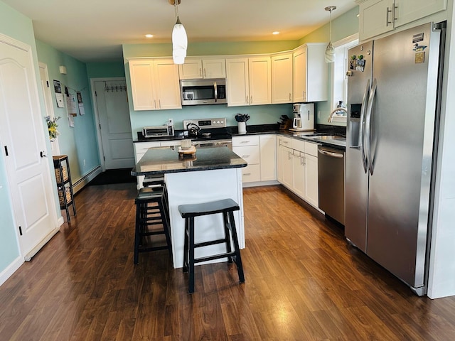 905 Blackstream Rd, Hermon, ME 04401 - kitchen with stainless steel appliances, dark countertops, dark wood-type flooring, and recessed lighting