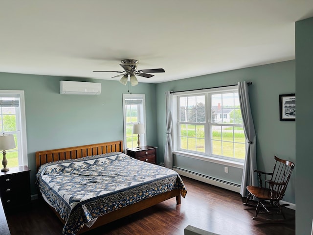 905 Blackstream Rd, Hermon, ME 04401 - bedroom with a baseboard heating unit, a wall mounted air conditioner, dark wood finished floors, and a ceiling fan