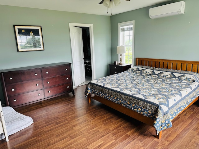 905 Blackstream Rd, Hermon, ME 04401 - bedroom with a wall unit AC and wood finished floors