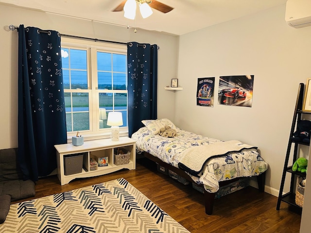 905 Blackstream Rd, Hermon, ME 04401 - bedroom with a wall unit AC, wood finished floors, ceiling fan, and multiple windows