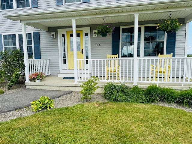 905 Blackstream Rd, Hermon, ME 04401 - doorway to property featuring a porch and a yard