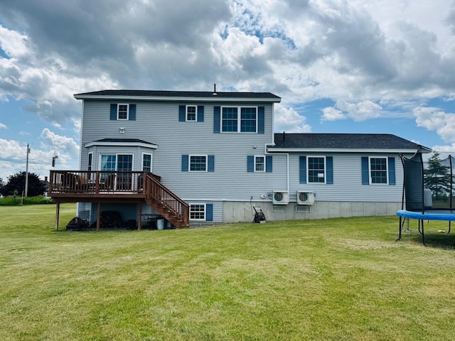 905 Blackstream Rd, Hermon, ME 04401 - back of house featuring a trampoline, a wooden deck, stairs, and a lawn