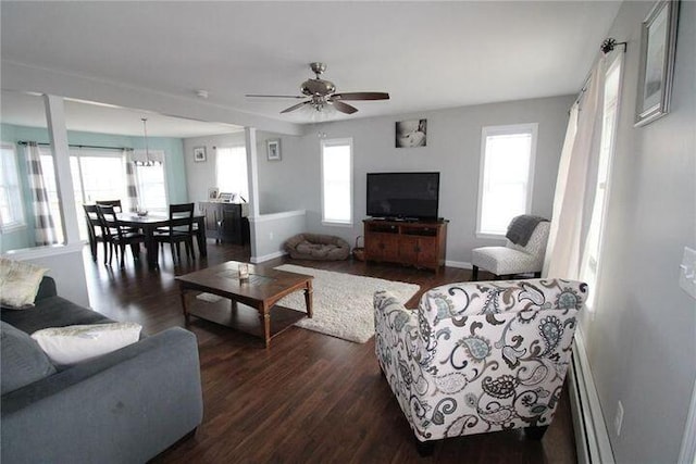 905 Blackstream Rd, Hermon, ME 04401 - living area featuring a baseboard heating unit, plenty of natural light, and dark wood-type flooring