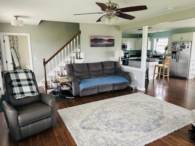 905 Blackstream Rd, Hermon, ME 04401 - living area featuring ceiling fan, stairway, and dark wood-type flooring