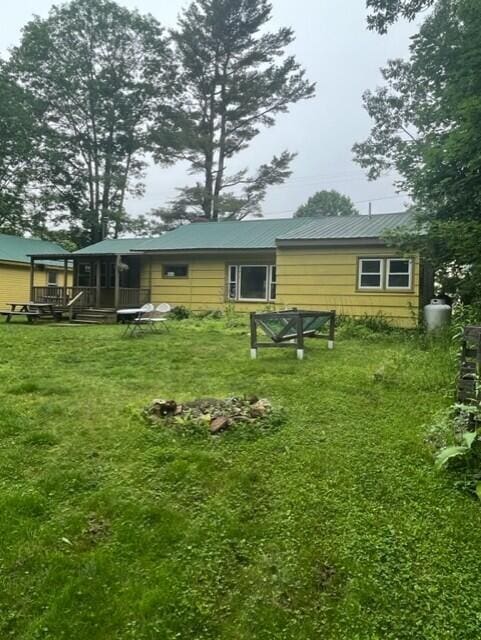 22 Lamb Farm Rd, Brunswick, ME 04011 - rear view of property featuring a lawn