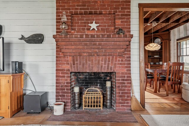 6 Fort Hill Ave, York, ME 03909 - living room featuring wood walls and a brick fireplace