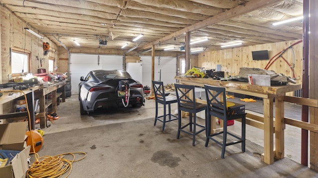 178 Potter Rd, Hudson, ME 04449 - garage with a workshop area and freestanding refrigerator