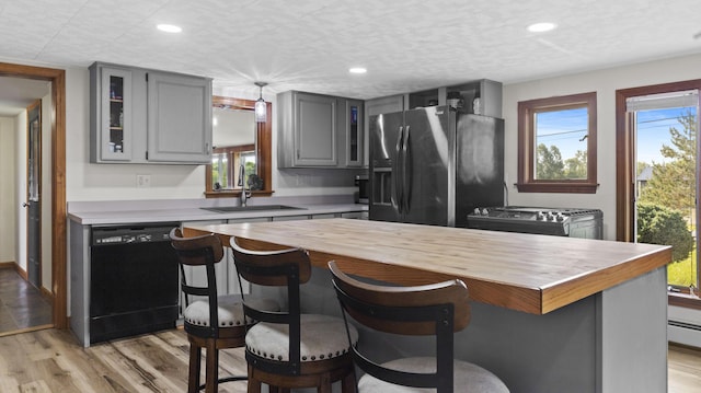 178 Potter Rd, Hudson, ME 04449 - kitchen featuring dishwasher, stainless steel fridge with ice dispenser, gray cabinetry, glass insert cabinets, and stove