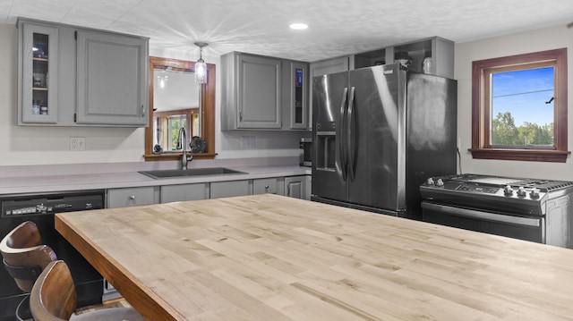 178 Potter Rd, Hudson, ME 04449 - kitchen featuring gray cabinetry, stainless steel appliances, plenty of natural light, glass insert cabinets, and recessed lighting