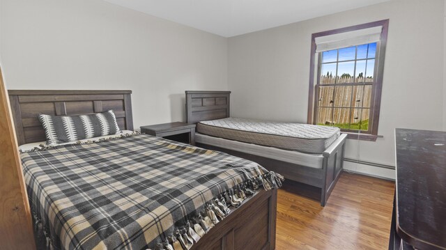 178 Potter Rd, Hudson, ME 04449 - bedroom featuring baseboard heating and light wood finished floors