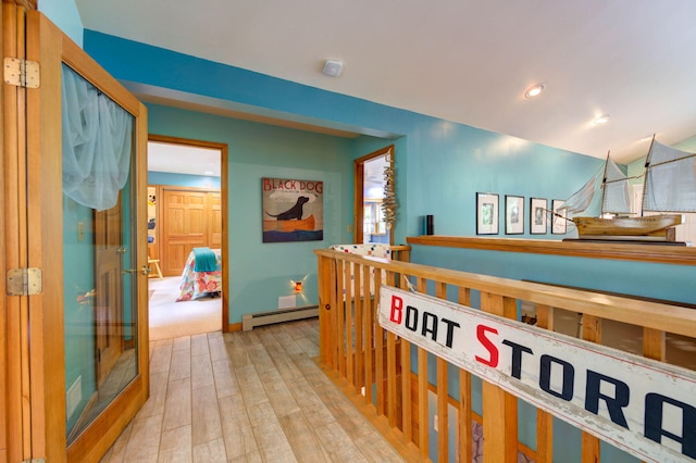 147 Spring Valley Rd, Raymond, ME 04071 - hall featuring a baseboard radiator and wood finished floors