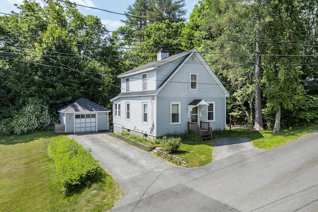 8 Riverview Ave, Lewiston, ME 04240 - view of front of home featuring an outbuilding, driveway, a garage, a chimney, and a front yard