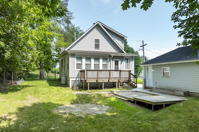8 Riverview Ave, Lewiston, ME 04240 - rear view of house with a deck and a lawn