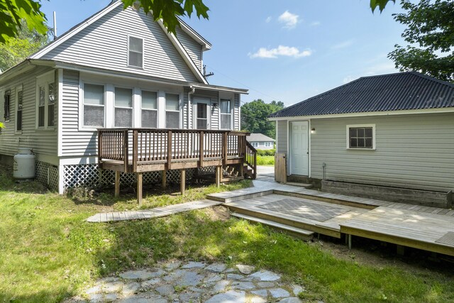 8 Riverview Ave, Lewiston, ME 04240 - back of property featuring a wooden deck and a yard