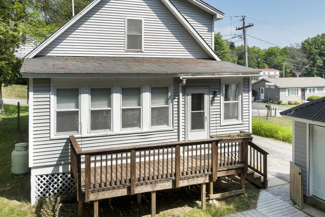 8 Riverview Ave, Lewiston, ME 04240 - rear view of property with a deck and roof with shingles