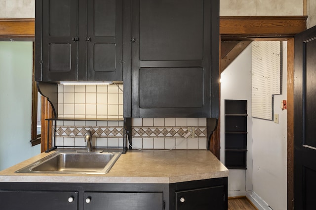 8 Riverview Ave, Lewiston, ME 04240 - kitchen with decorative backsplash and dark cabinets