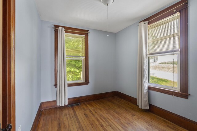 8 Riverview Ave, Lewiston, ME 04240 - empty room with hardwood / wood-style flooring and baseboards