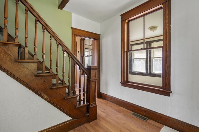 8 Riverview Ave, Lewiston, ME 04240 - staircase with baseboards and wood finished floors