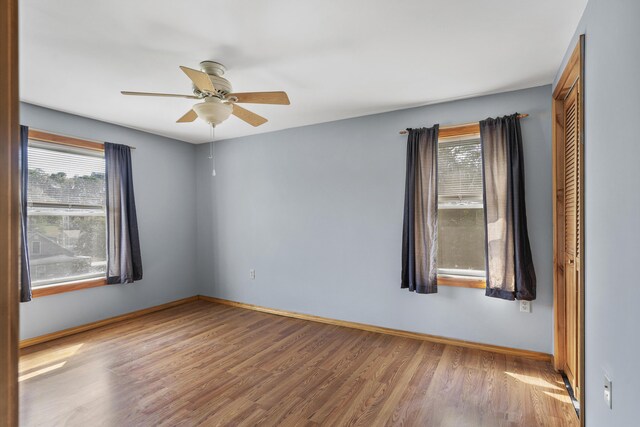 8 Riverview Ave, Lewiston, ME 04240 - unfurnished room with wood finished floors and ceiling fan