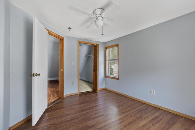 8 Riverview Ave, Lewiston, ME 04240 - unfurnished bedroom with dark wood finished floors, a closet, and a ceiling fan