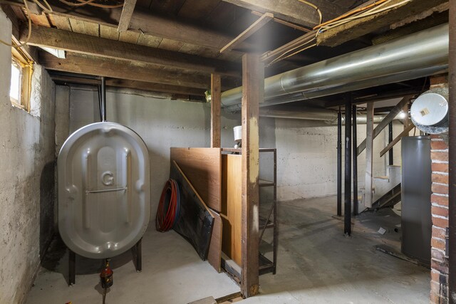 8 Riverview Ave, Lewiston, ME 04240 - basement featuring water heater, oil tank, and stairs
