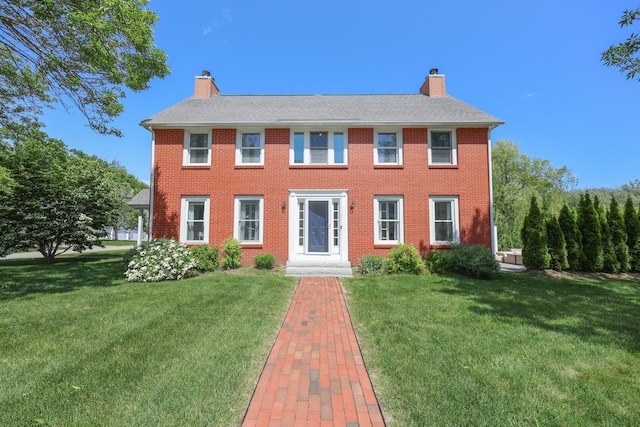 1 Ephraim Tyler Way Unit 1, Kennebunk, ME 04043 - colonial home featuring a chimney, a front lawn, and brick siding