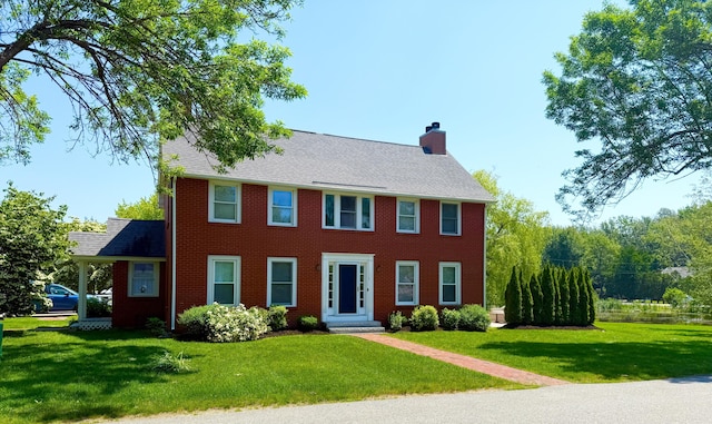 1 Ephraim Tyler Way Unit 1, Kennebunk, ME 04043 - colonial home with a chimney, a front lawn, brick siding, and roof with shingles