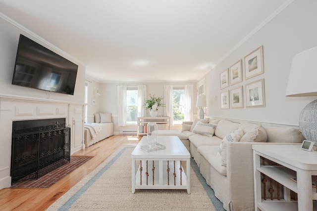 1 Ephraim Tyler Way Unit 1, Kennebunk, ME 04043 - living area with wood finished floors, a fireplace with flush hearth, baseboard heating, and ornamental molding