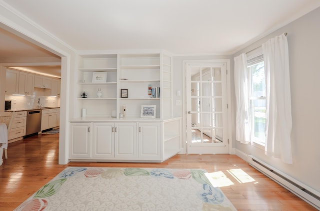1 Ephraim Tyler Way Unit 1, Kennebunk, ME 04043 - interior space with baseboard heating, healthy amount of natural light, and light wood-type flooring