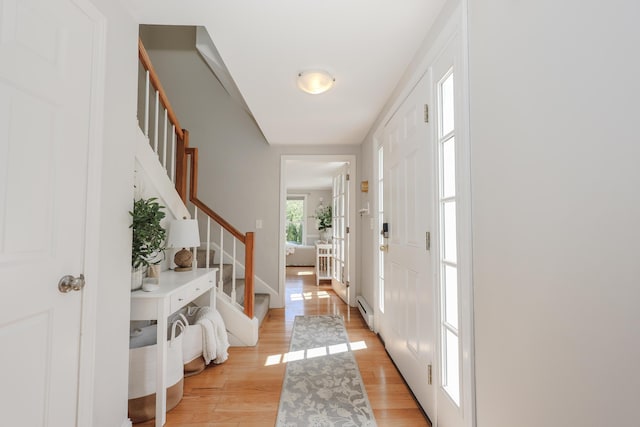 1 Ephraim Tyler Way Unit 1, Kennebunk, ME 04043 - entryway with stairs, light wood-type flooring, and a baseboard heating unit